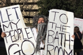 John Erler '89 protesting a bathroom bill dressed as Moses
